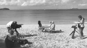 film crew filming at the beach