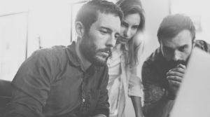 team looking serious at computer