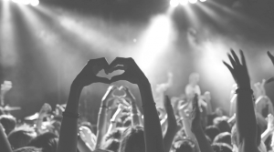 audience in a gig showing love for the band